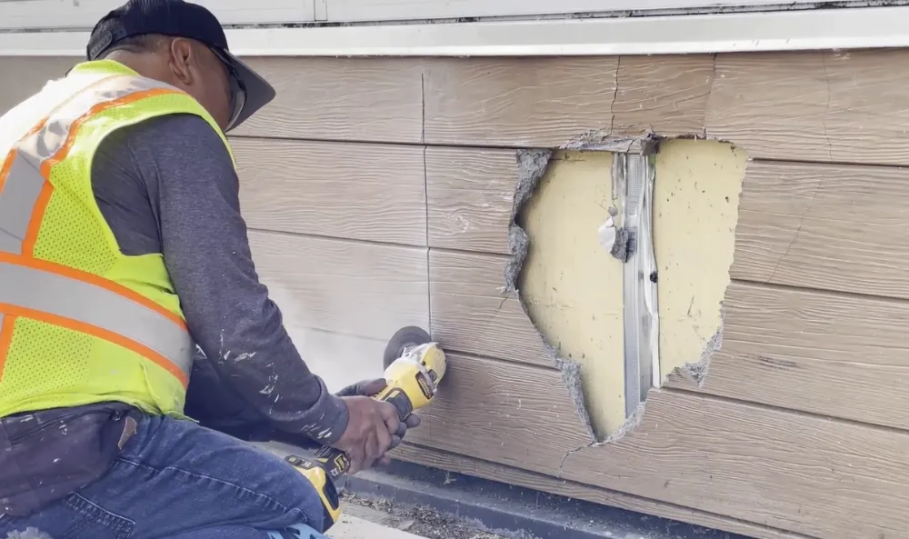 Fiber cement siding repair crew at work