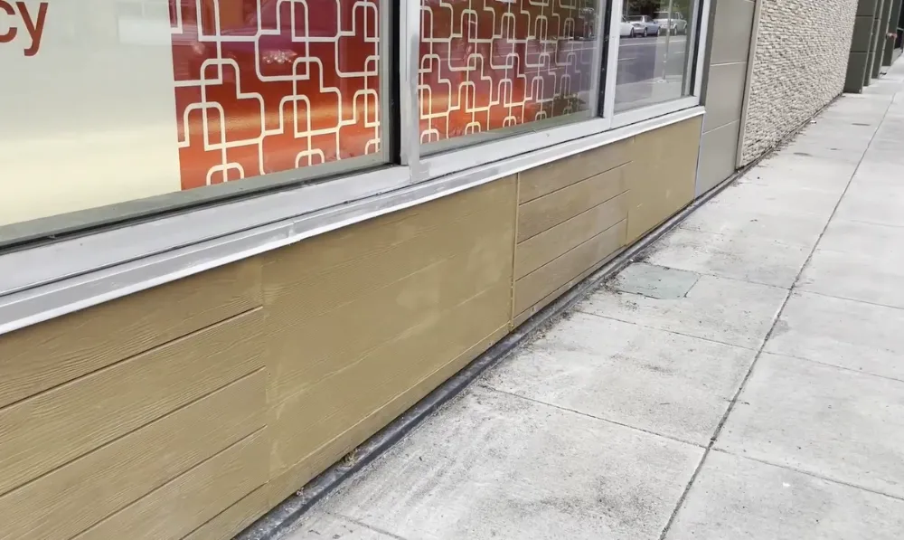 Fiber cement siding after repair, color-matched