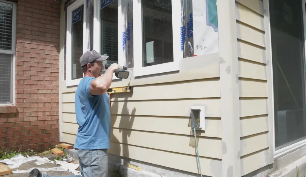 Team working on siding installation